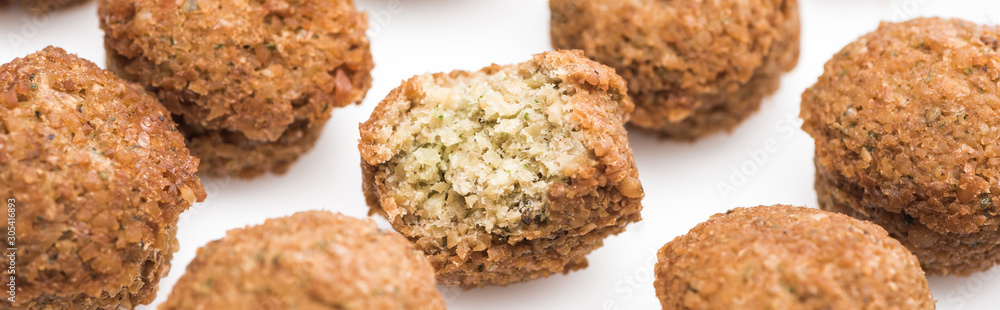 close up view of delicious fresh cooked falafel balls on white background, panoramic shot close up view of delicious fresh cooked falafel balls on white background, panoramic shot