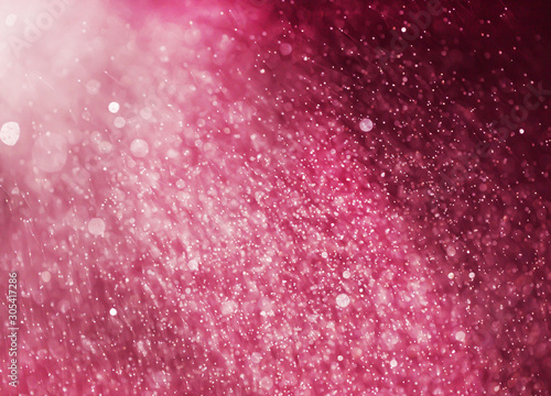 Abstract blurred background of purple water droplets bokeh with light effect