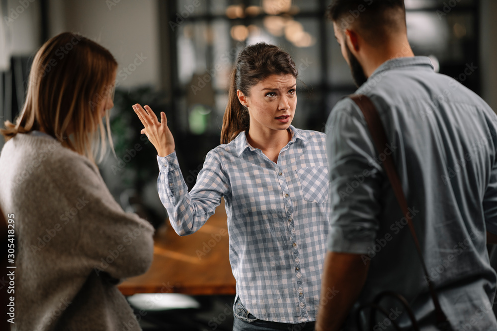 Colleagues arguing in office. Problem in team. Business people at meeting. Colleagues arguing in office. Problem in team. Business people at meeting.