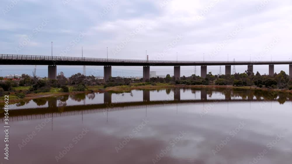 The vibrant wetland and nature sanctuary pink lake drone shot at Westgate Bridge located on the edged of the city in Port Melbourne. The vibrant wetland and nature sanctuary pink lake drone shot at Westgate Bridge located on the edged of the city in Port Melbourne.