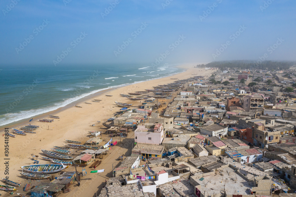 Aerial view of fishing village, pirogues fishing boats in Kayar, Senegal.  Photo made by drone from above. Africa Landscapes.