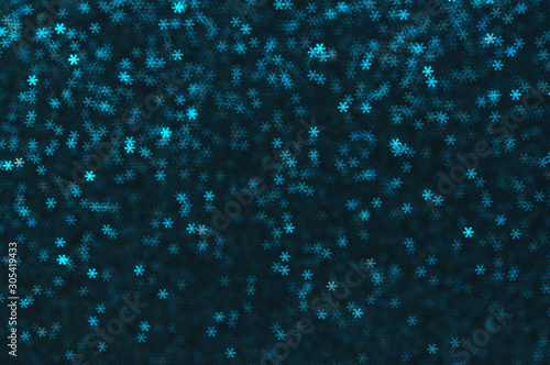 Blue snowflakes bokeh abstract background.