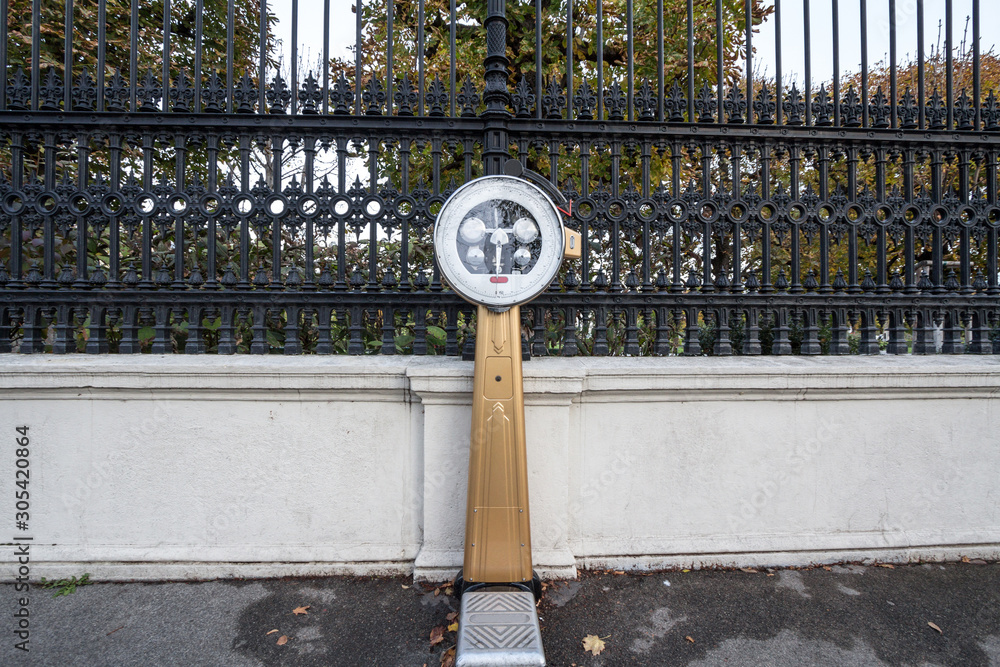 Vintage public street scale, from the 19th century, on display in the