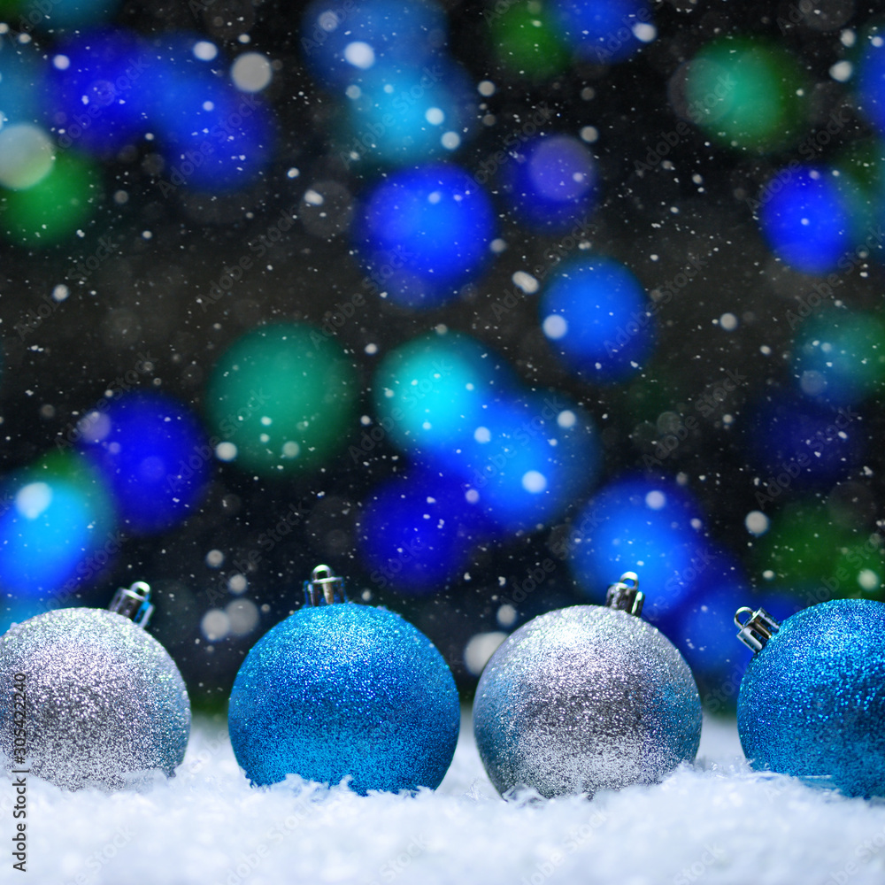 Christmas card.Christmas Toys in the snow with a bright background and falling snow. Square photo. Instagram Christmas card.Christmas Toys in the snow with a bright background and falling snow. Square photo. Instagram