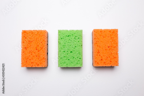 Sponge for washing dishes on a white isolated background.