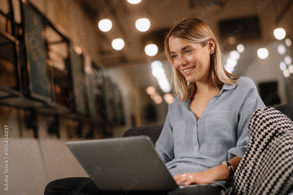 Girl on her laptop at home. Woman using her laptop while lying down. Young female works from home. Girl on her laptop at home. Woman using her laptop while lying down. Young female works from home.