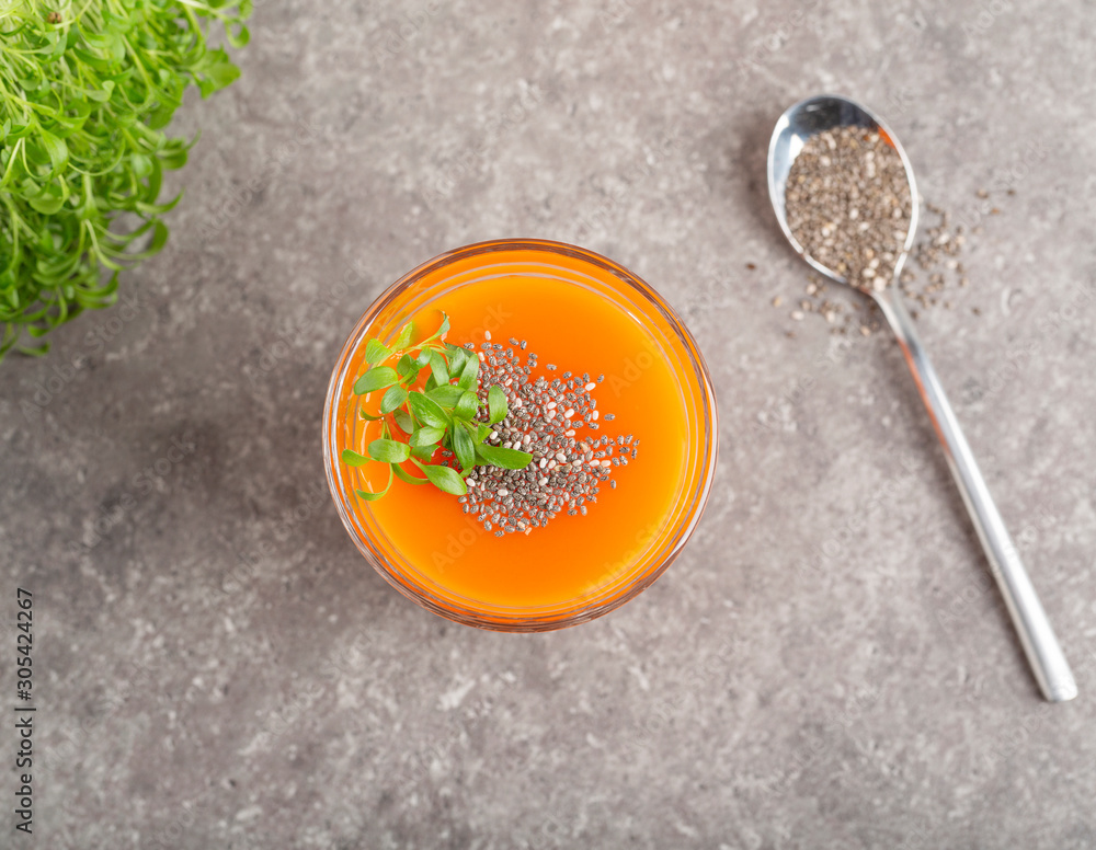 Fresh carrot smoothie with Chia seeds and herbs. Healthy organic carrots smoothie. Detox concept Fresh carrot smoothie with Chia seeds and herbs. Healthy organic carrots smoothie. Detox concept
