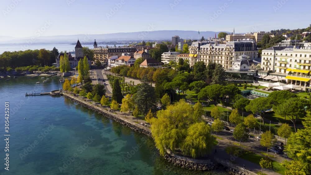 Aerial Hyper lapse of lake, roads, docks and buildings at the beautiful city Lausanne, Switzerland Aerial Hyper lapse of lake, roads, docks and buildings at the beautiful city Lausanne, Switzerland
