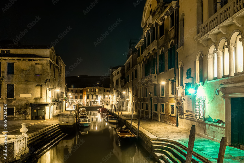 Clear sky over a beautiful canal in Venice at night