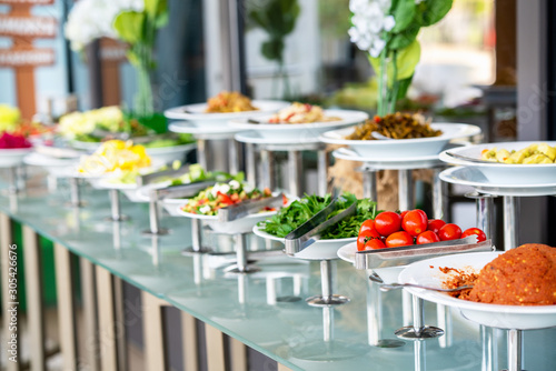 A delicious appetizer and salad buffet with various options in a restaurant or hotel photo