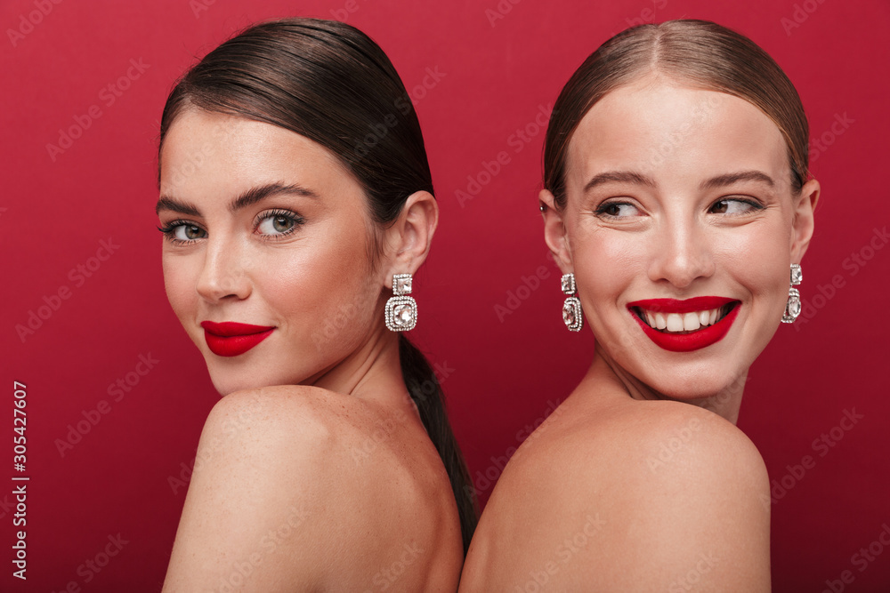 Cheery positive two women with bright red lipstick - obrazy, fototapety, plakaty 