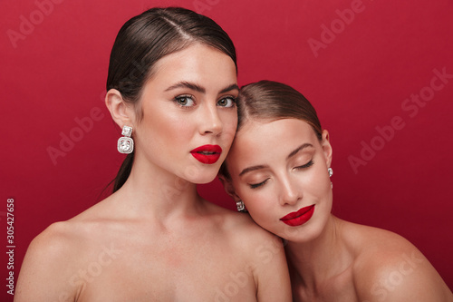 Beautiful young two women with bright red lipstick