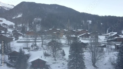 Cinematic aerial view at Lavertezzo, Switzerland in winter season. Lavertezzo is a small village with a valley and mountains along the river Verzasca in the Swiss canton Ticino.