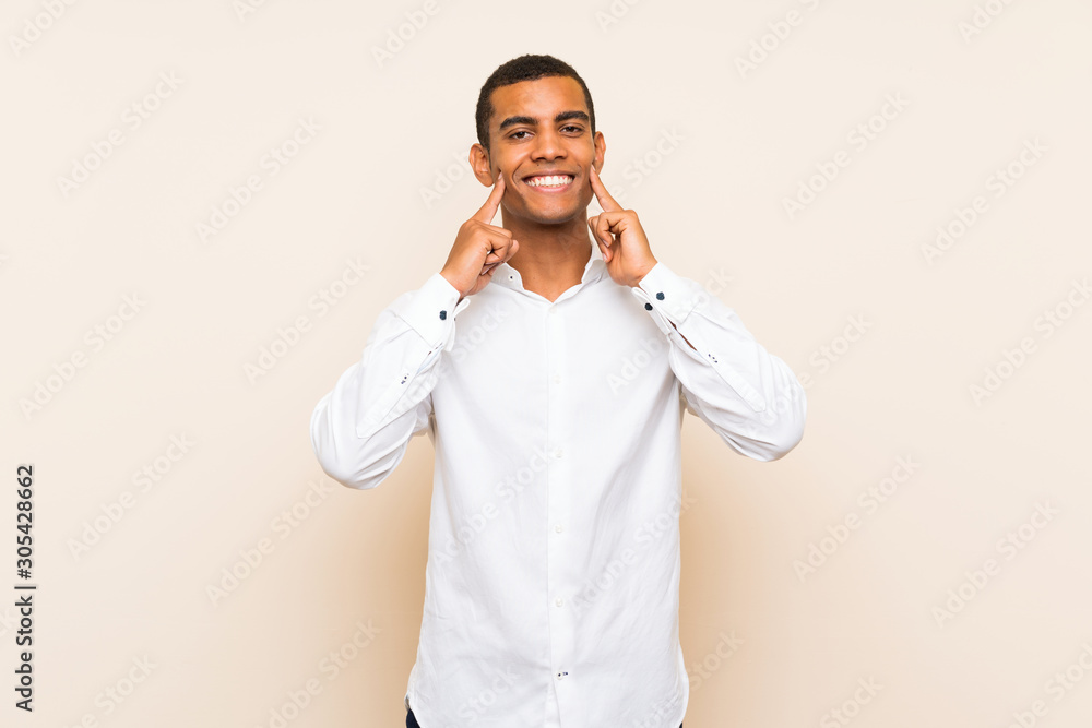 Young handsome brunette man over isolated background smiling with a happy and pleasant expression Young handsome brunette man over isolated background smiling with a happy and pleasant expression