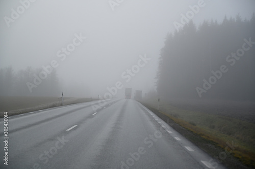 slippery morning road with poor wiew in november © Jonas