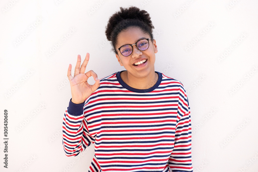 cute african american girl with glasses and ok hand sign cute african american girl with glasses and ok hand sign