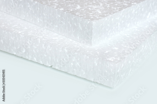 Quadro su tela Styrofoam sheet on a white background. polystyrene