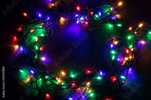 Christmas garland lights on darck background