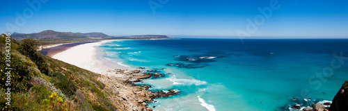 Panoramic of surfers at Noordhoek Beach, Cape Town
