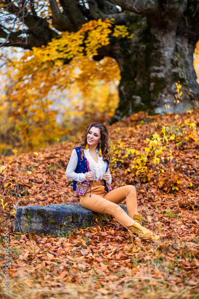 Portrait of a beautiful woman in autumn landscape Portrait of a beautiful woman in autumn landscape