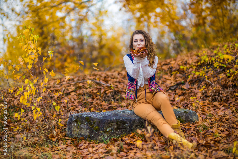 Portrait of a beautiful woman in autumn landscape Portrait of a beautiful woman in autumn landscape