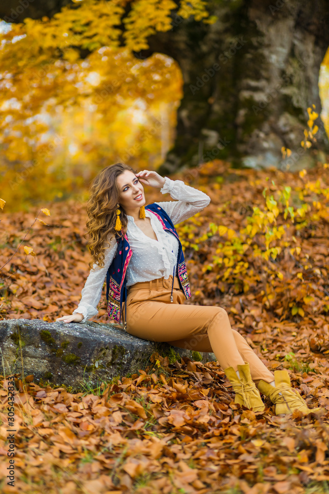 Portrait of a beautiful woman in autumn landscape Portrait of a beautiful woman in autumn landscape