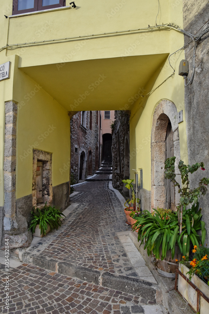 Fornelli, 11/23/2019. A narrow street among the old houses of a mountain village in the Molise region