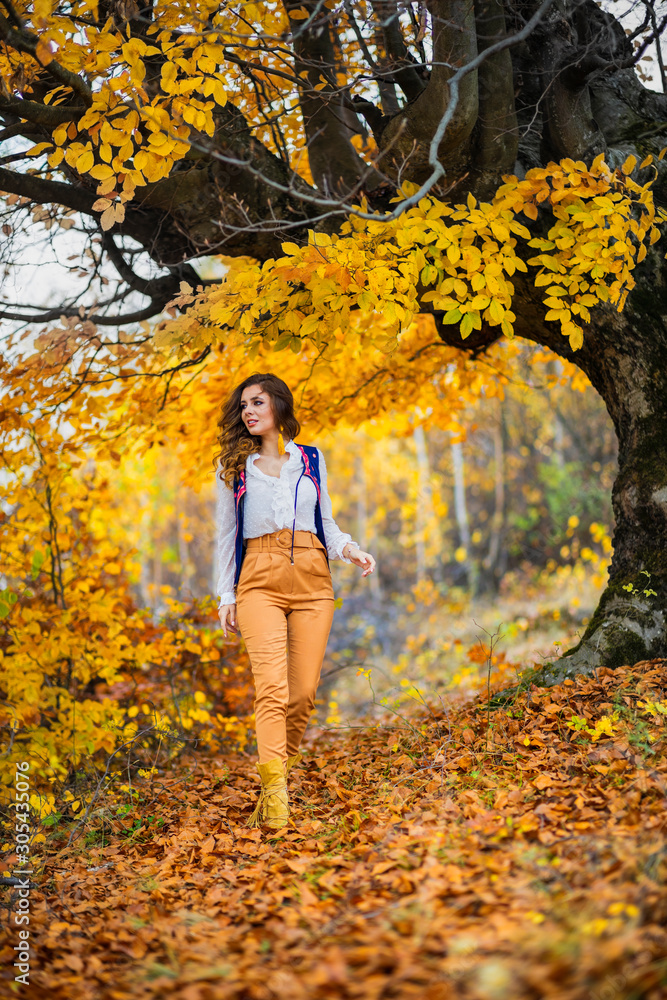 Portrait of a beautiful woman in autumn landscape Portrait of a beautiful woman in autumn landscape