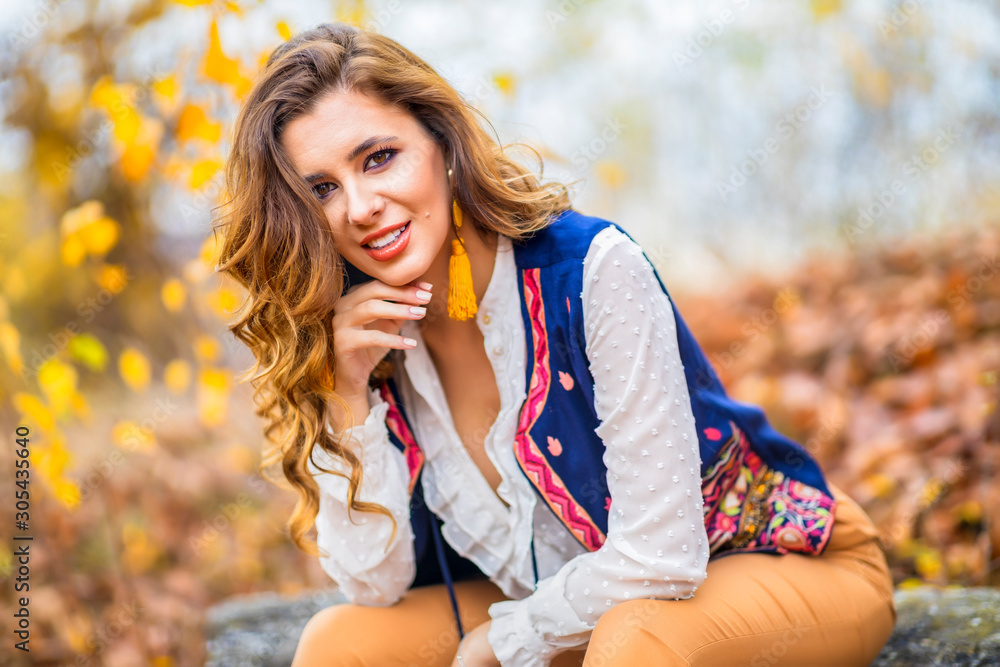 Portrait of a beautiful woman in autumn landscape Portrait of a beautiful woman in autumn landscape