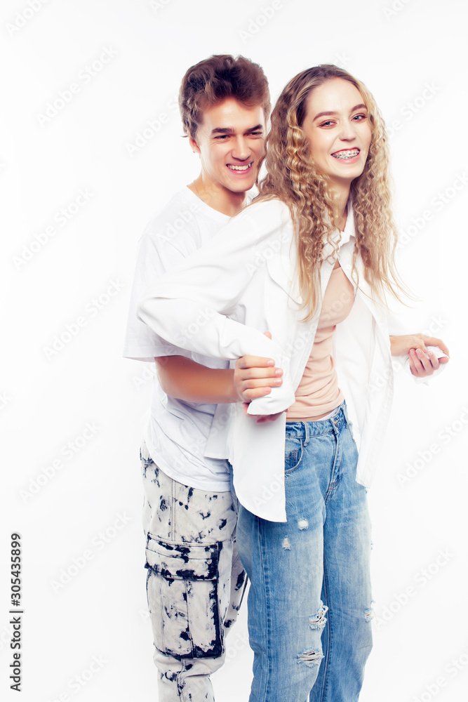 young pretty couple together posing cheerful isolated on white background, lifestyle people concept, happy boy and girl