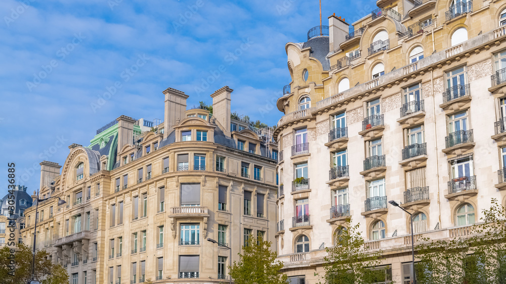 Paris, charming street and buildings, typical parisian facades in the Marais 
