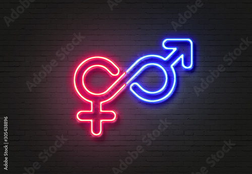 Male and female symbols on blue and pink neon signs