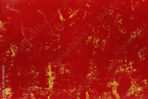 Red, golden texture surface. Color vintage grunge background for text or design. © banphote