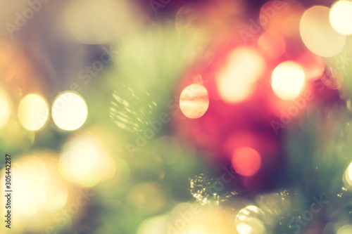 Christmas tree bokeh blur abstract background for merry x'mas party and new year celebration in red green gold color for xmas holiday night light © Chinnapong