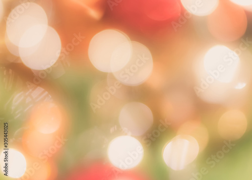 Christmas tree bokeh blur abstract background for merry x mas party and new year celebration in red green gold color for xmas holiday night light 