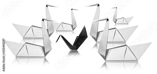 Fototapeta Naklejka Na Ścianę i Meble -  Bullying concept - Six white paper swans face a black swan