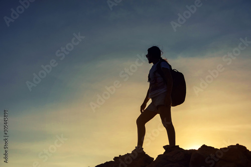 Fototapeta Naklejka Na Ścianę i Meble -  Silhouette hiking sporty woman at summit