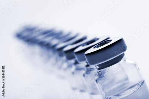 Glass medicine vials on a white background photo