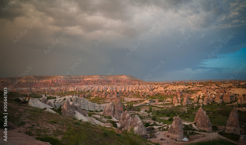 Sunset panoramic view to Goreme city and valleys, Cappadocia, Turkey