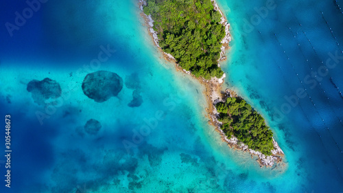 Aerial view on islands on sea. Azure water and islands with trees. Seascape from air at the summer time. Travel - image