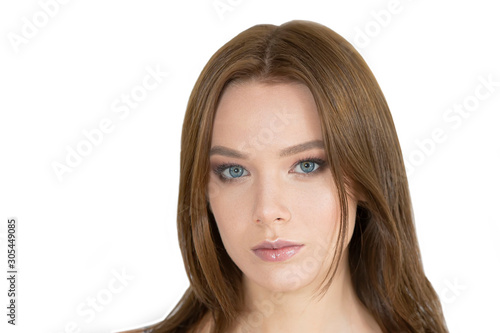 Face of a beautiful young girl on a white background