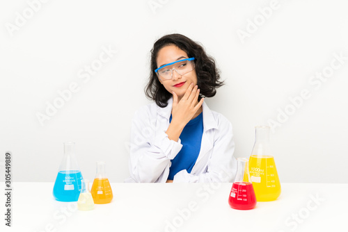Young scientific asian girl thinking an idea