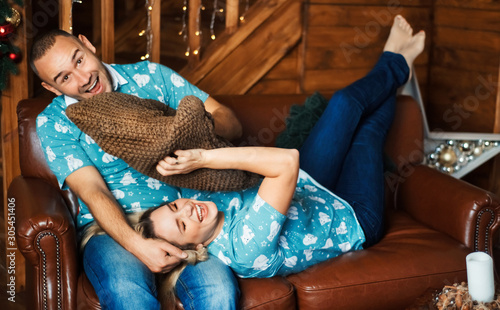 Bilde på lerret Happy emotional couple have fun together on the couch