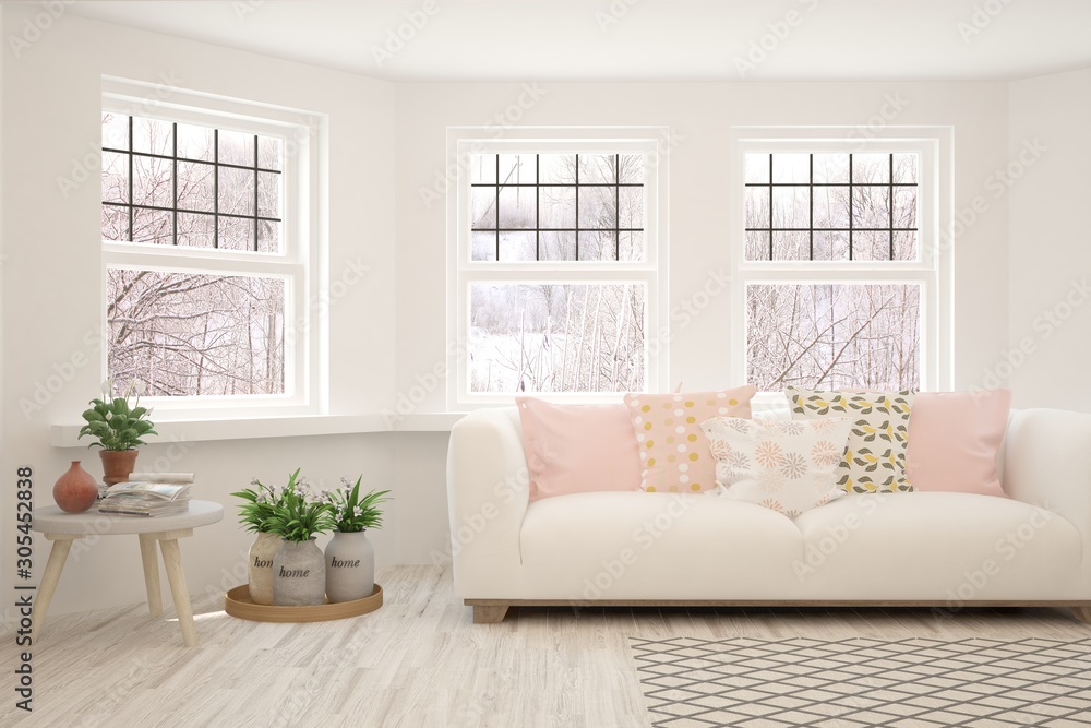 Fototapeta premium Stylish room in white color with sofa and winter landscape in window. Scandinavian interior design. Hight resolution image. 3D illustration