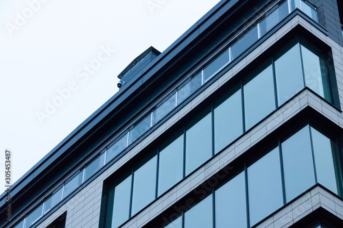 house wall with windows against the sky