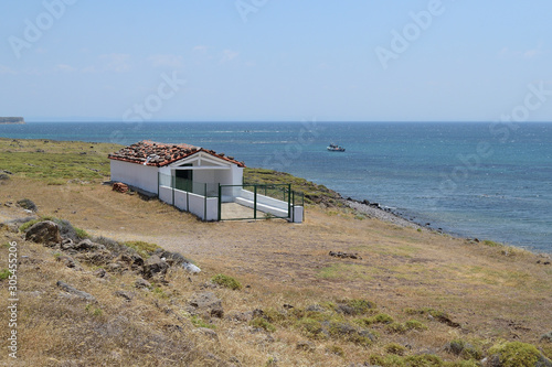 Seascape from turkish aegean island Gokceada - white greek chapel on the shore