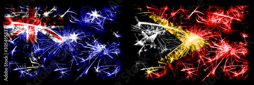Australia, Ozzie vs East Timor New Year celebration sparkling fireworks flags concept background. Combination of two abstract states flags. © Vlad