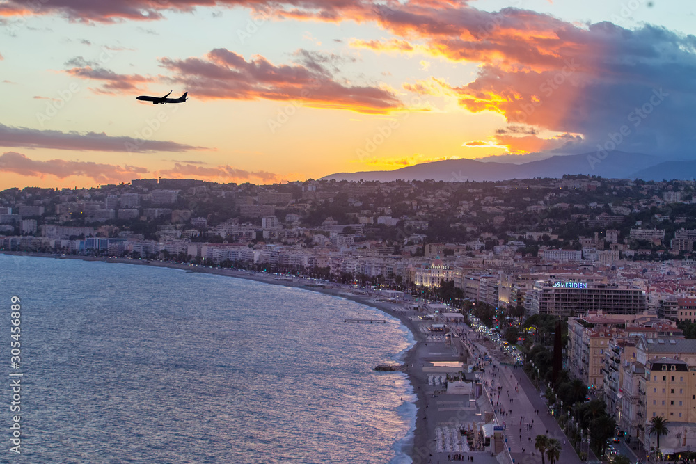 Majestic Panorama of Nice  France Sunset and airplane  to international  airport of Nice, French Riviera