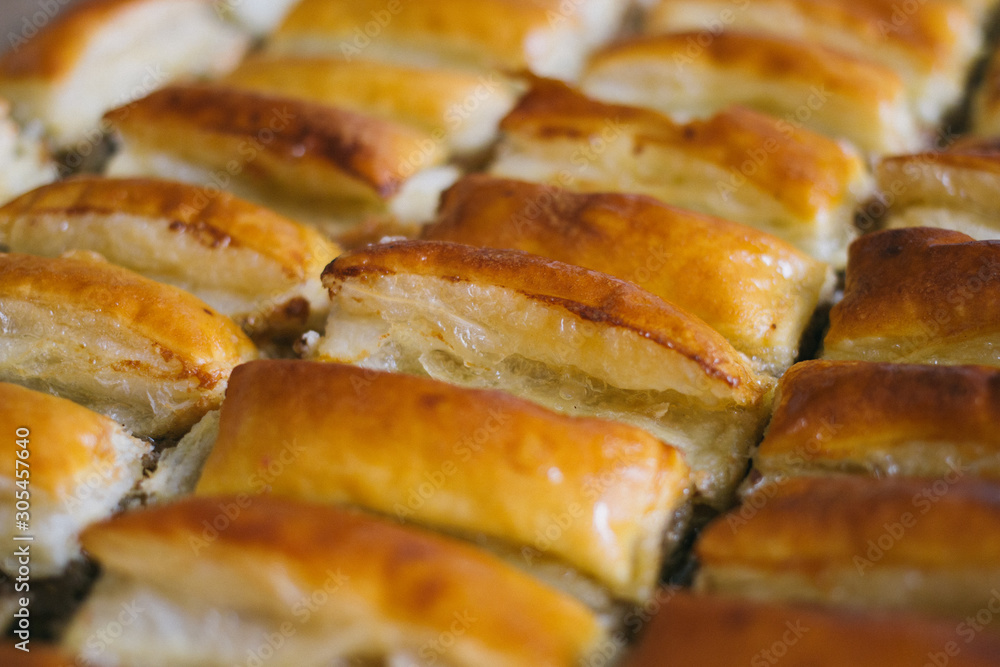 texture of Puff pastry cakes with sugar powder close up