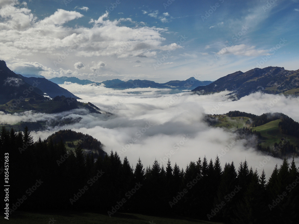 Fototapeta premium Views of the cloudy valley from the Col des Mosses in the Bernese Alps of Switzerland